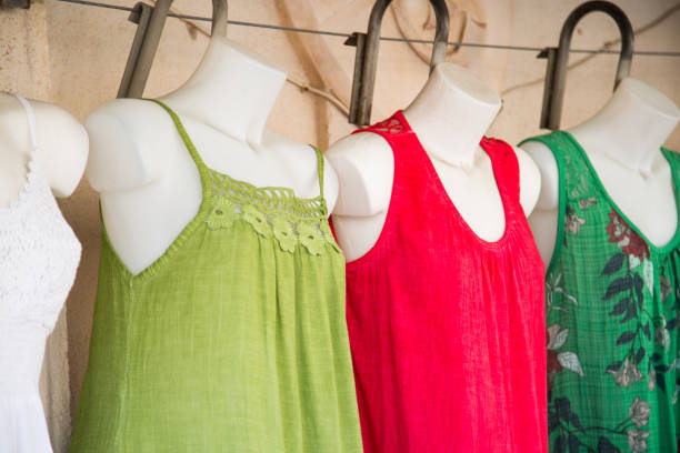 istock Colorful dresses on a shop window doll 838898598