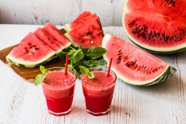 istock healthy drinks. watermelon smoothie on white wooden background 838909568
