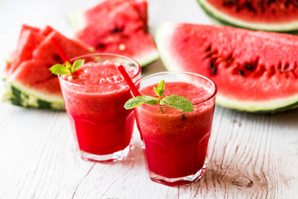 istock healthy drinks. watermelon smoothie on white wooden background 838909594