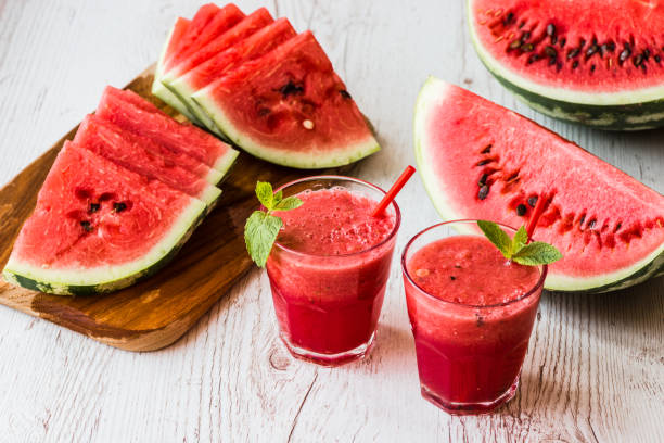 istock healthy drinks. watermelon smoothie on white wooden background 838909606