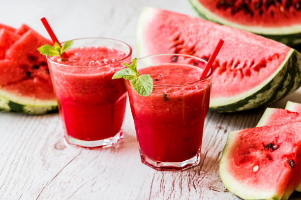 istock healthy drinks. watermelon smoothie on white wooden background 838909630