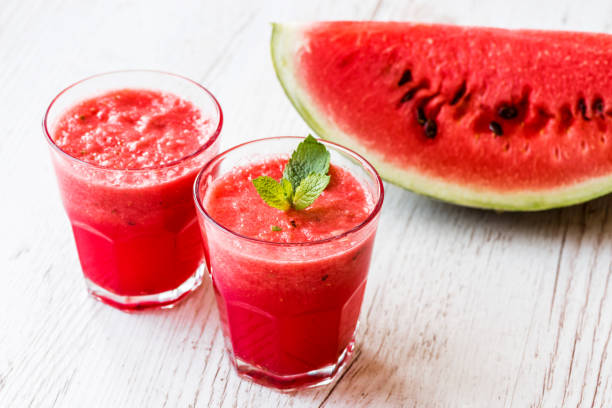 istock healthy drinks. watermelon smoothie on white wooden background 838909634