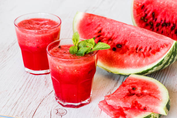 istock healthy drinks. watermelon smoothie on white wooden background 838909696