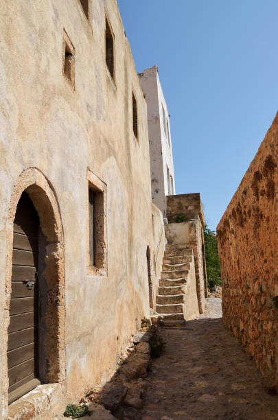 istock Narrow paved pathway in fortress town Monemvasia 838913348