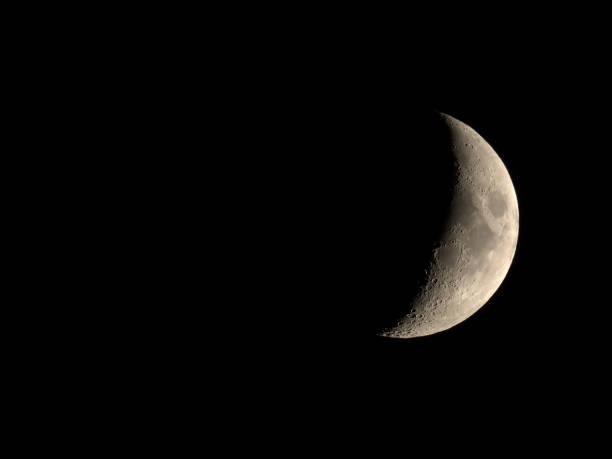 istock Waxing crescent moon seen with telescope 838916854