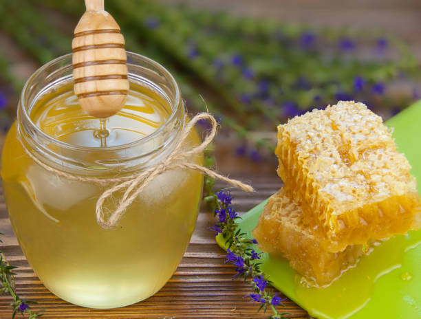 istock Delicious delicious honey in  jar on table 838917098