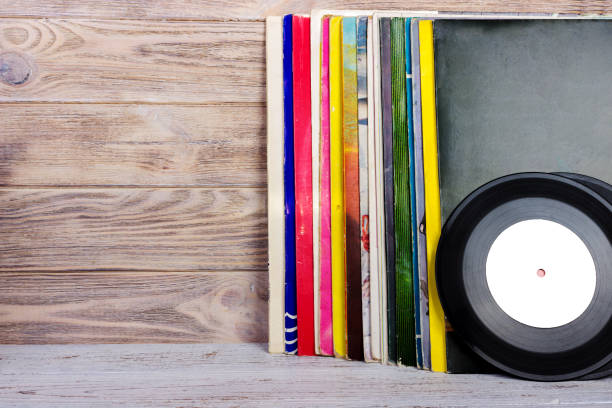 istock Vinyl records and headphones on table. Vintage vinyl disk 838917706