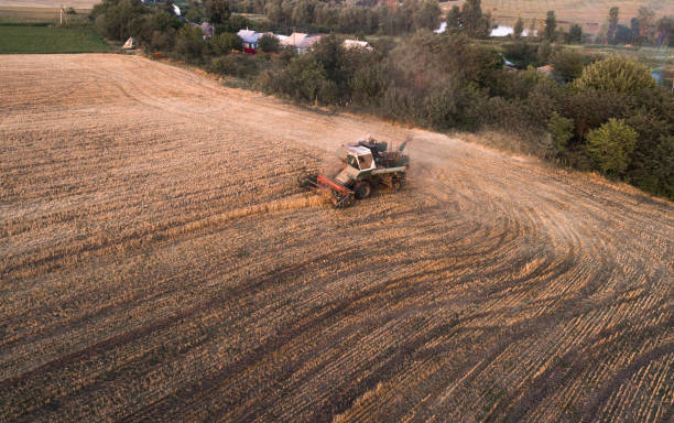 istock Harvester working in field and mows wheat. Ukraine. Aerial view. 838926440