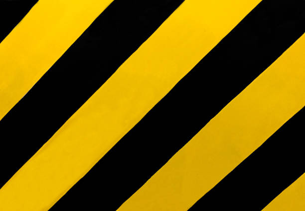 Traffic Sign: A rectangular sign with diagonal yellow and black stripes, wherever there is a median or other obstruction. Drive in the direction of the slope of the stripes to avoid the obstructions.