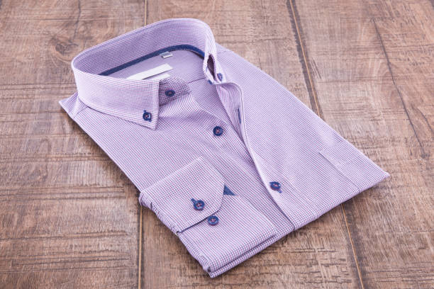 istock Man's shirt folded on a wooden background 838940970