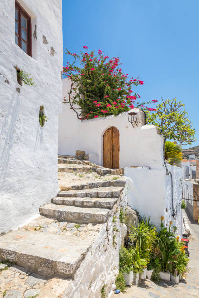 istock White wall and stone staircase. Typical greek town architecture 838941150
