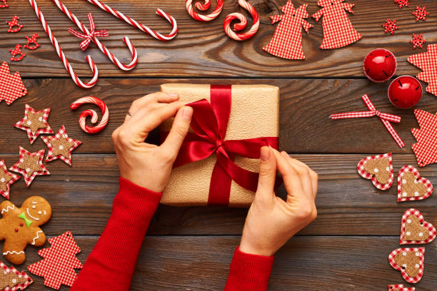 istock Female hands on christmas gift 838944486