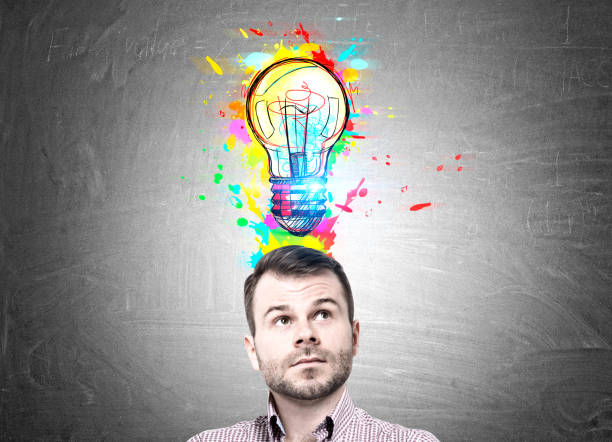istock Pensive bearded man and colorful light bulb 838955206