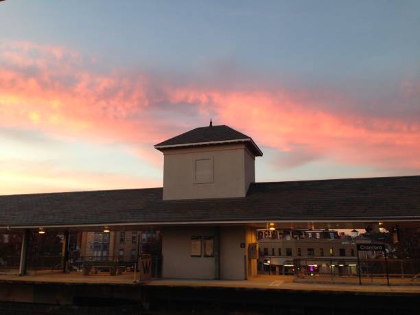 istock Sunset Small Town Train Station Cranford Cloud Strip Town Lights Angle Crop 838955490