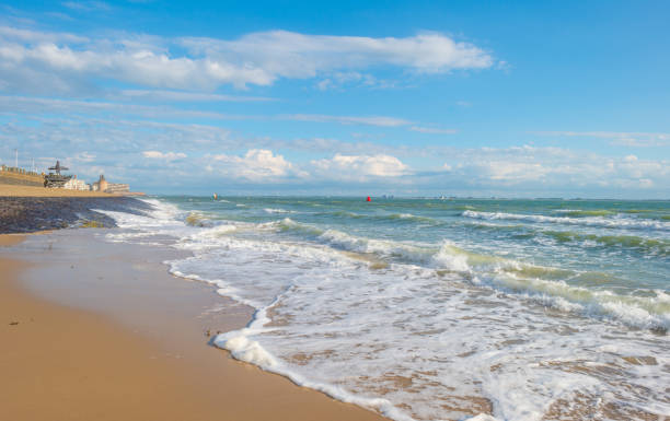 istock Blue cloudy sky over a sand beach along the sea in summer 838958694