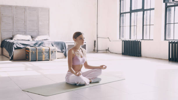 istock Beautiful yoga girl doing asanas in studio 838958994