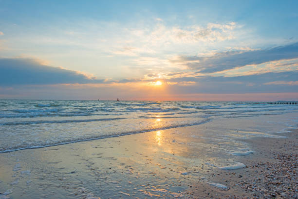 istock Blue cloudy sky over a sand beach along the sea in summer 838962198