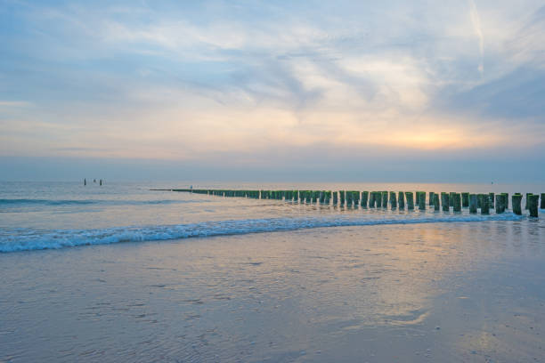 istock Blue cloudy sky over a sand beach along the sea in summer 838962408