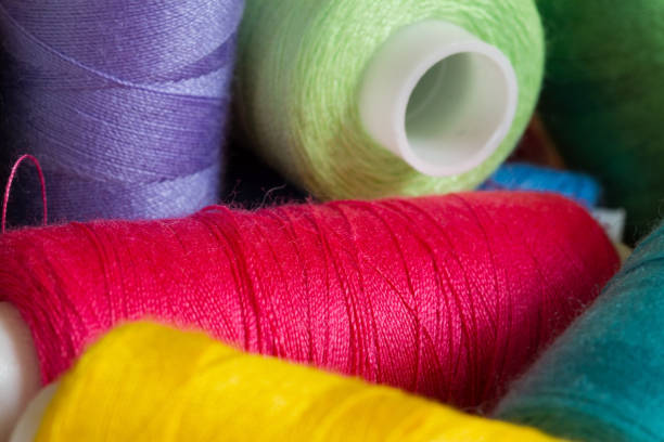 istock Pile of coloured bobbins of thread 838962472