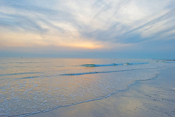 istock Blue cloudy sky over a sand beach along the sea in summer 838962492