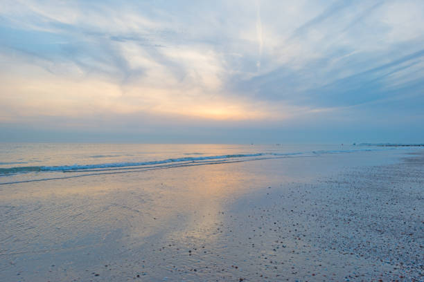 istock Blue cloudy sky over a sand beach along the sea in summer 838963096