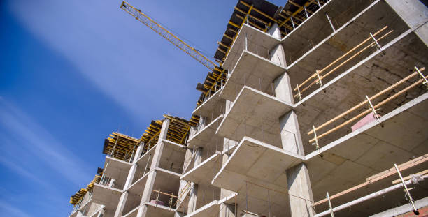 istock apartment building on blue sky background 838966834