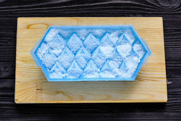 istock A blue plastic ice cube tray with frost on it 838969584