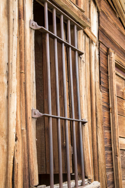 Bars on window of old wooden jail in Bodie State Historic Park,