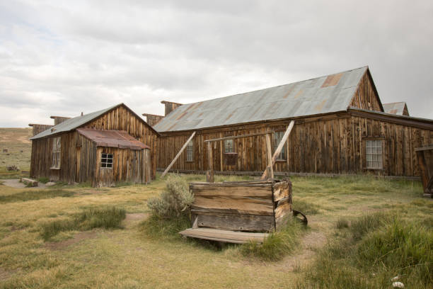 istock Wooden well outside barn in field, Bodie 838982142