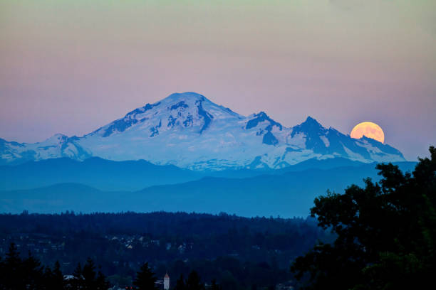 istock snow mountain with moonrise at sunset 838986776