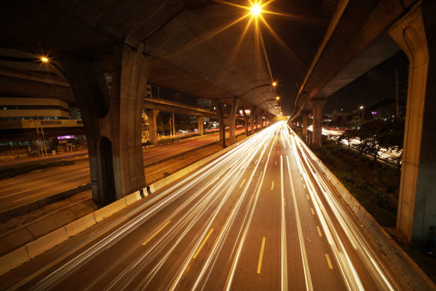 istock Light trails of fast moving Cars 838989302