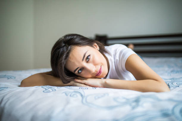 istock Young beauty woman lying on the bed 838993258