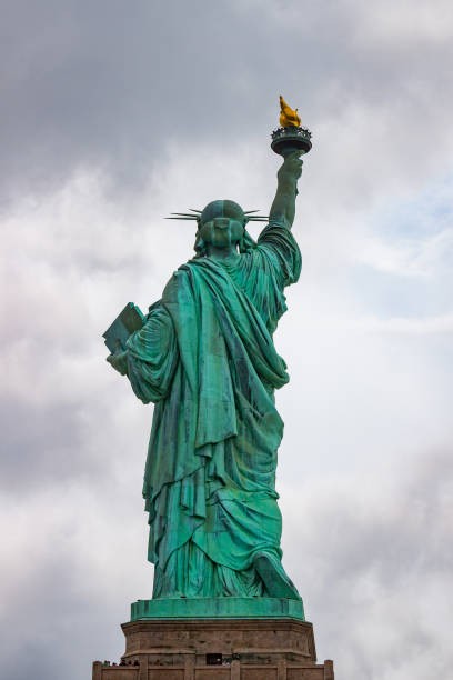 istock American Flag Blowing In Wind On Cloudy Day 838993946