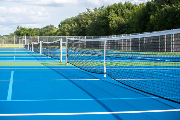 Row of Six Outdoor Tennis Courts stock photo