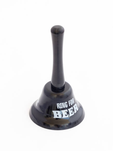 istock Decorative bell with a handle made of black plastic with the inscription 