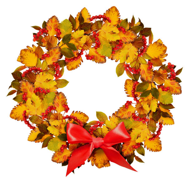 istock Autumn wreath from dry colored leaves and rowan berries with red bow 839018056