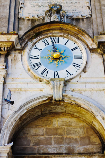 Spoleto, Umbria, Italy: A medieval clock in Piazza del Mercato in historic Spoleto (Perugia Province).