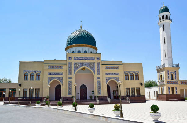 istock The mosque is yellow with a large minaret. 839024364