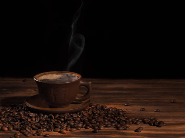 istock Coffee cup on a wooden backgound. 839028316