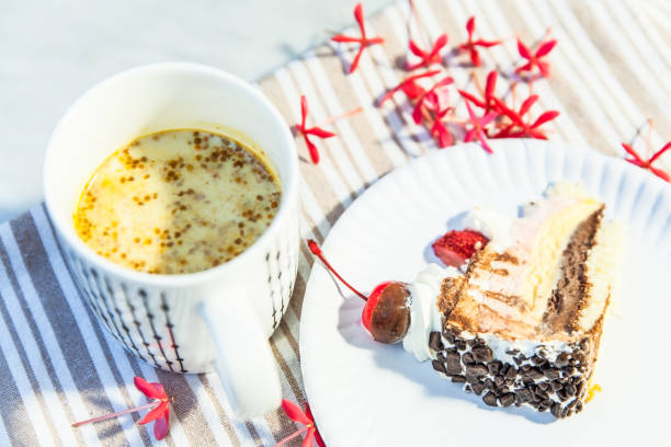 istock Hot drink cup and a piece of cake 839029496