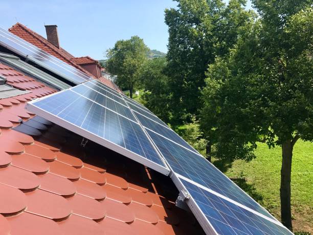 istock House roof with solar panels on top 839029652
