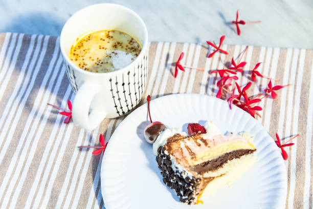 istock Hot drink cup and a piece of cake 839029678