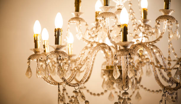istock Beautiful chandelier light on dark background 839033706