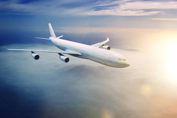 istock Airplane in the sky at sunset 839034080