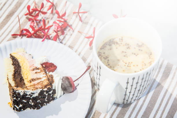 istock Hot drink cup and a piece of cake 839034202