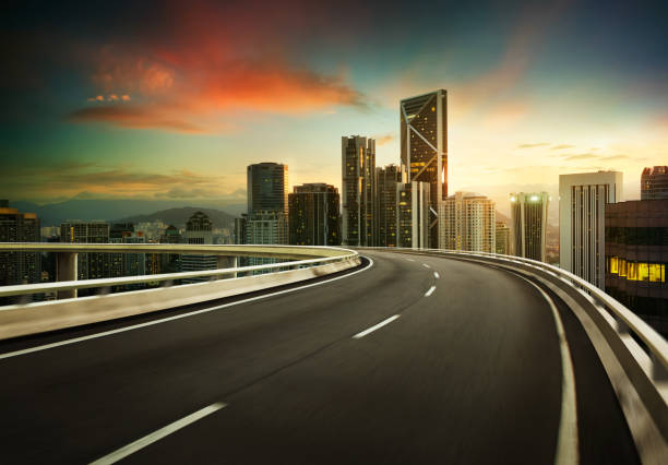 istock Highway overpass motion blur with city background . 839037302