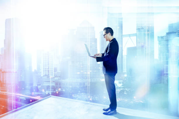istock Businessman using laptop with generic office background , night scene . 839037742
