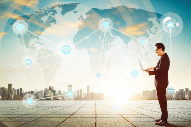 istock Businessman using laptop with smart city and wireless communication network background , evening scene . 839039900