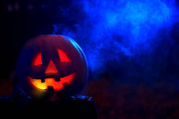 istock Smiling pumpkin for Halloween in dark at forest. 839040550