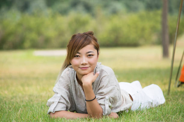 istock On women in the grass 839044236